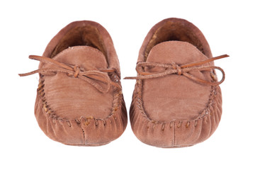 Pair of moccasin slippers isolated on white