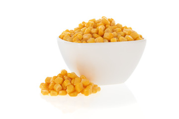Sweet corn in a bowl isolated on a white background - obrazy, fototapety, plakaty