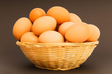 Basket of eggs on the colourful background