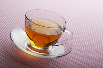 Tea cup on pink background