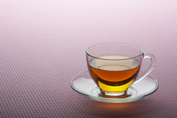 Tea cup on pink background