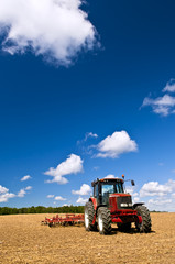 Tractor in plowed field