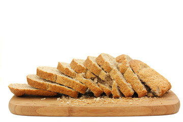 Wholemeal sliced bread on board isolated