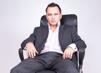 Young businessman sitting on chair