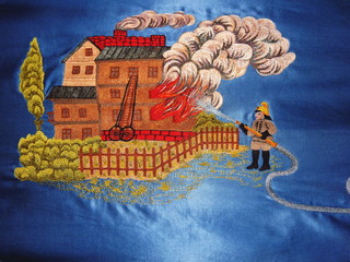 Fireman at work – detail of old fire brigade's flag