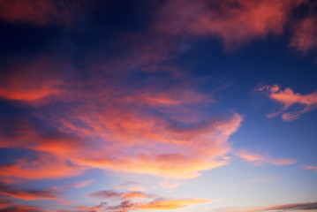 Naklejka na ściany i meble Dark colorful sunset clouds