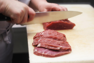 Chef Cutting Meat