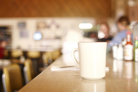 cup of coffee on the counter at a diner