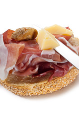 slice bread with parma ham and grana and dried fig