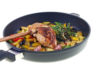 chicken & mediterranean vegetables in a pan isolated on white