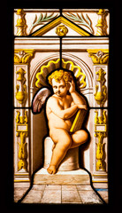 Cherub detail from a stained glass of Blois Chateau, France