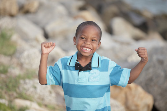 Young Boy Flexing His Muscles