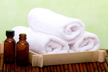 Fototapeta na wymiar Clean spa towels and essential oil