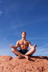 Man meditating outdoors