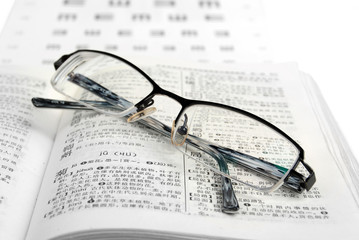dictionary and glasses