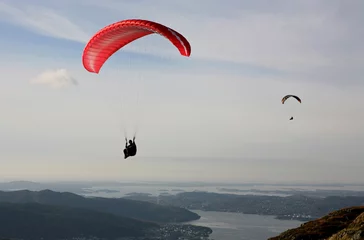 Papier Peint photo Lavable Sports aériens Two paragliders flying over Norwegian coastal landscape