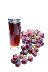 Grape cluster and juice in glass