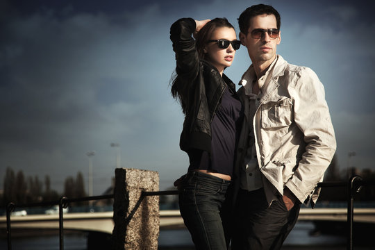 Attractive young couple wearing sunglasses