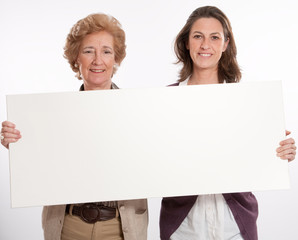 Women holding blank board