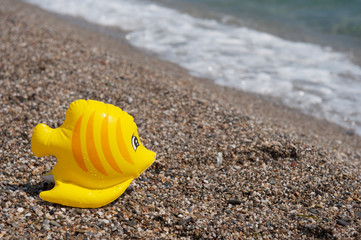Fototapeta na wymiar plastic toys at beach