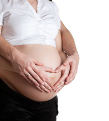 Advanced pregnant belly with hands