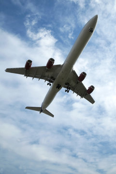 passenger jet on takeoff or landing against blue sky