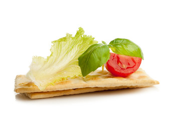 tomato basil and lettuce over cracker