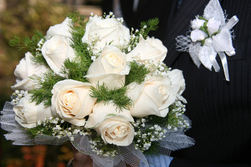 groom with  wedding bouquet