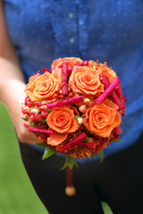 Girl holding an orange bouquet