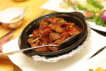 Roast meat with red pepper in china restaurant Beijing