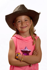 Portrait of a pretty little girl wearing a brown straw hat © wazymodo