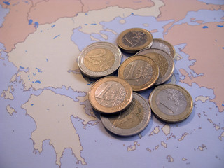 Euro coins on map Greece