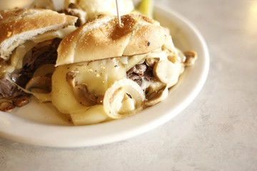 Steak and cheese sandwich at a diner.
