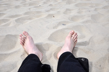 Fototapeta na wymiar foot on the beach