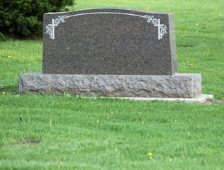 Blank headstone in cemetery - 22647623