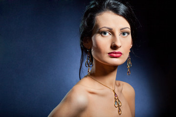 Portrait of elegant beautiful woman wearing jewelry.