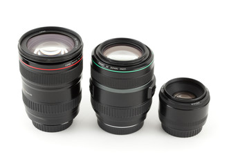 Three of lens to camera set in row. Isolated on white