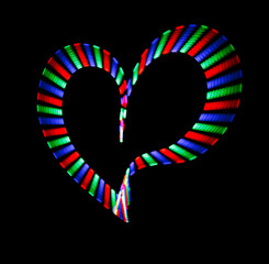 Multi-coloured shone heart on black background. Love symbol.