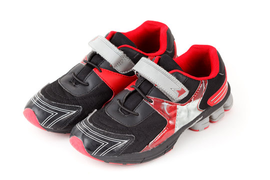 Pair of sports shoes, black and red colors on white. Isolated.