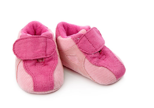 Pink baby shoes isolated on white background