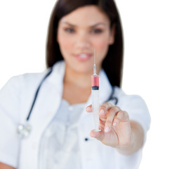 Professionnal female doctor holding a syringe