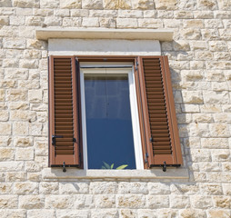 Fototapeta premium Brown window on brickwall.