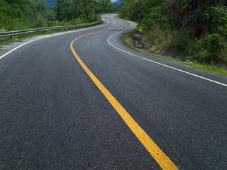 Fototapeta na wymiar The road curves up the mountain