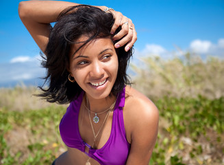 Beautiful caribbean woman smile on tropical beach