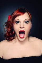 Screaming attractive redhead woman