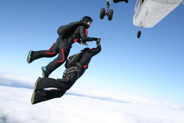 Two Skydivers jump from a plane