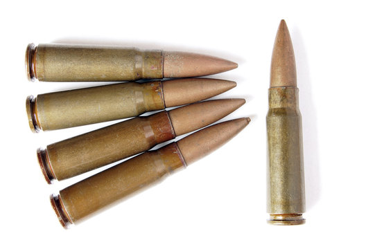 Five old and messy bullets isolated on white background