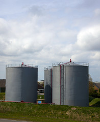 Oil tanks at industrial site with nice blue sky