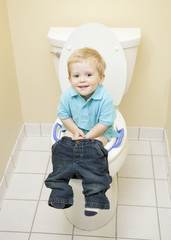 Little Boy Sitting on Toilet