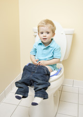 Young Child Sitting on the Toilet